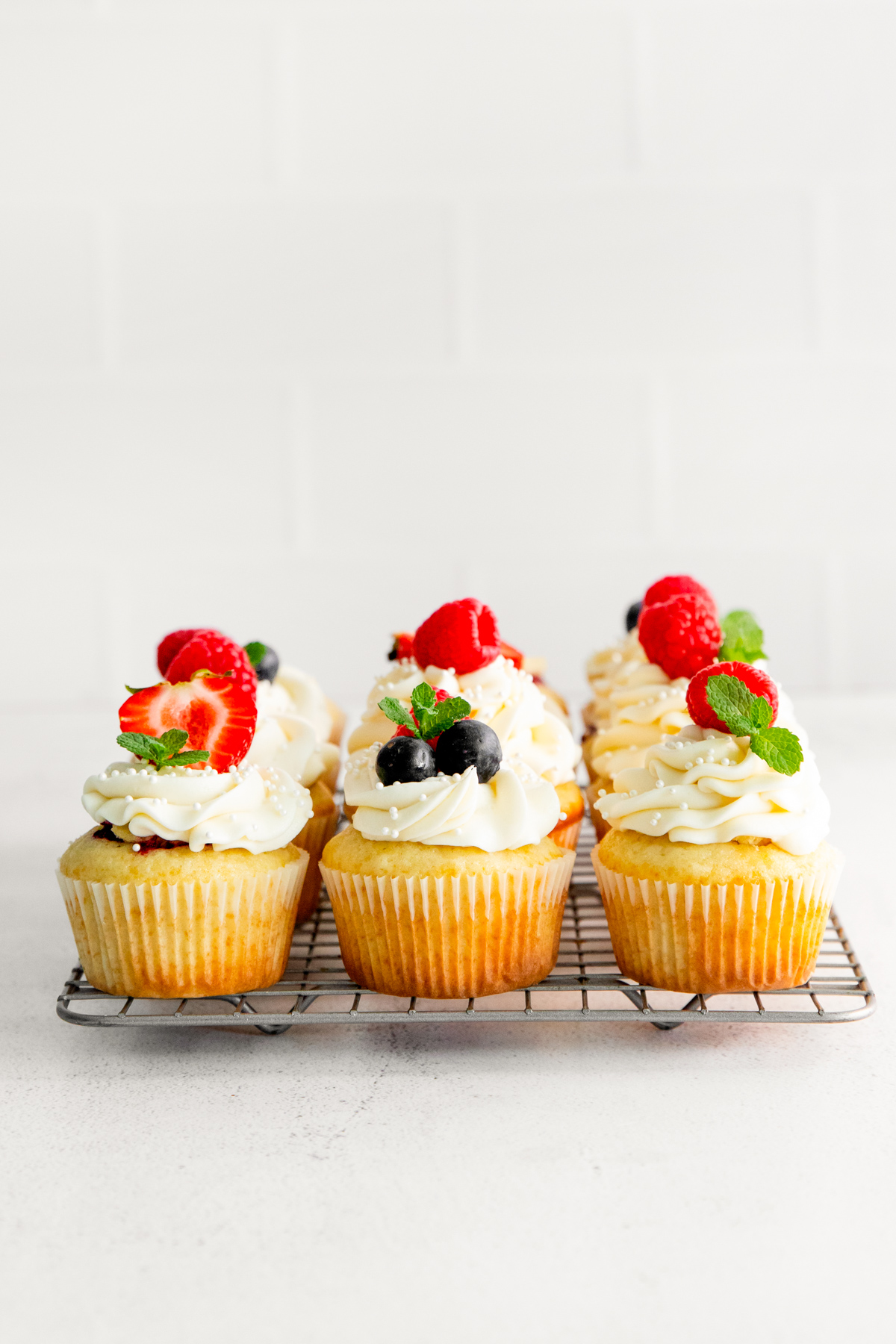 Mascarpone Berry Cupcakes topped with fresh berries. 