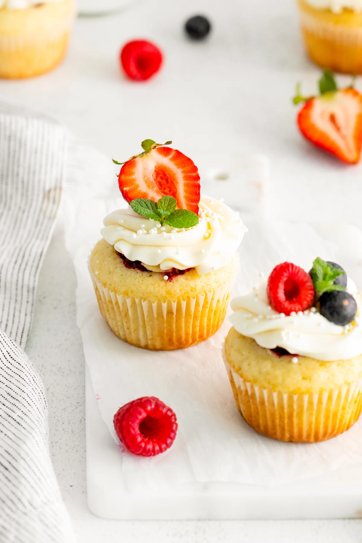 Mascarpone Berry Cupcakes topped with frosting. 