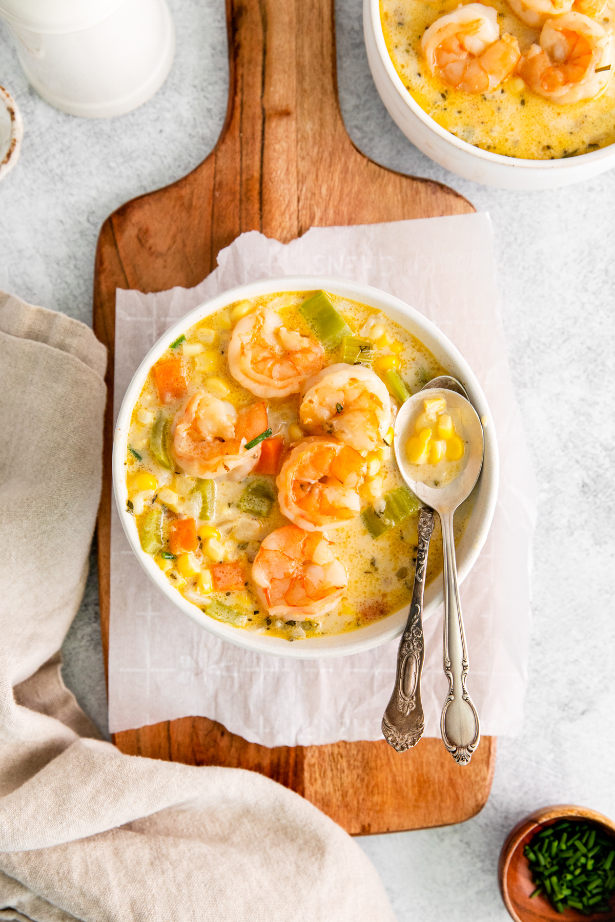 Shrimp Corn Chowder in a bowl with a spoonful of soup. 