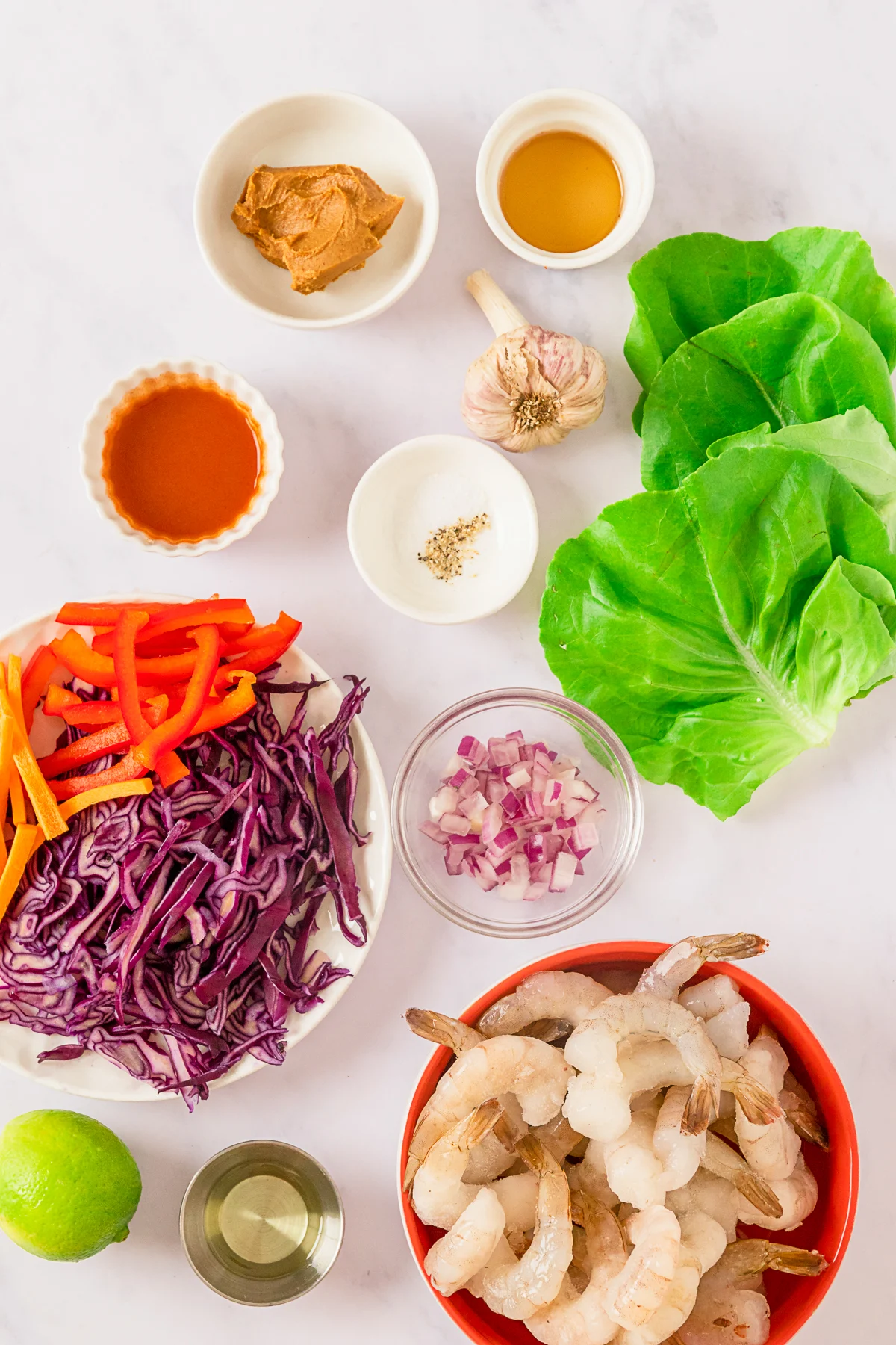 Shrimp Lettuce Wraps with Peanut Sauce ingredients on a table. 