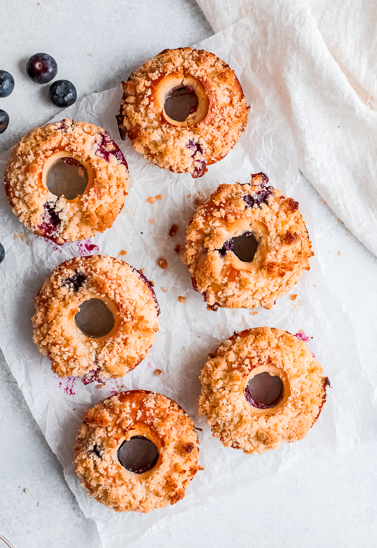 Baked Blueberry Streusel Donuts served on a table. 