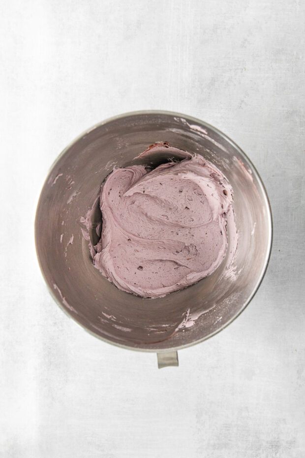 Blackberry frosting in a mixing bowl. 