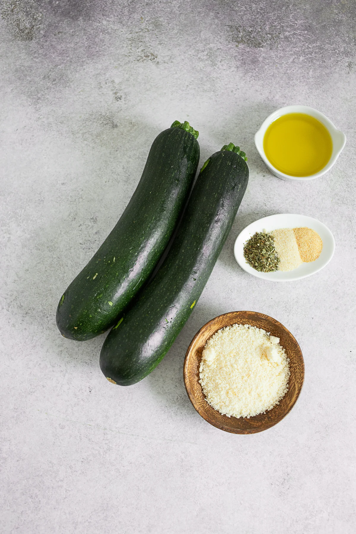Ingredients to make grilled zucchini on a table. 