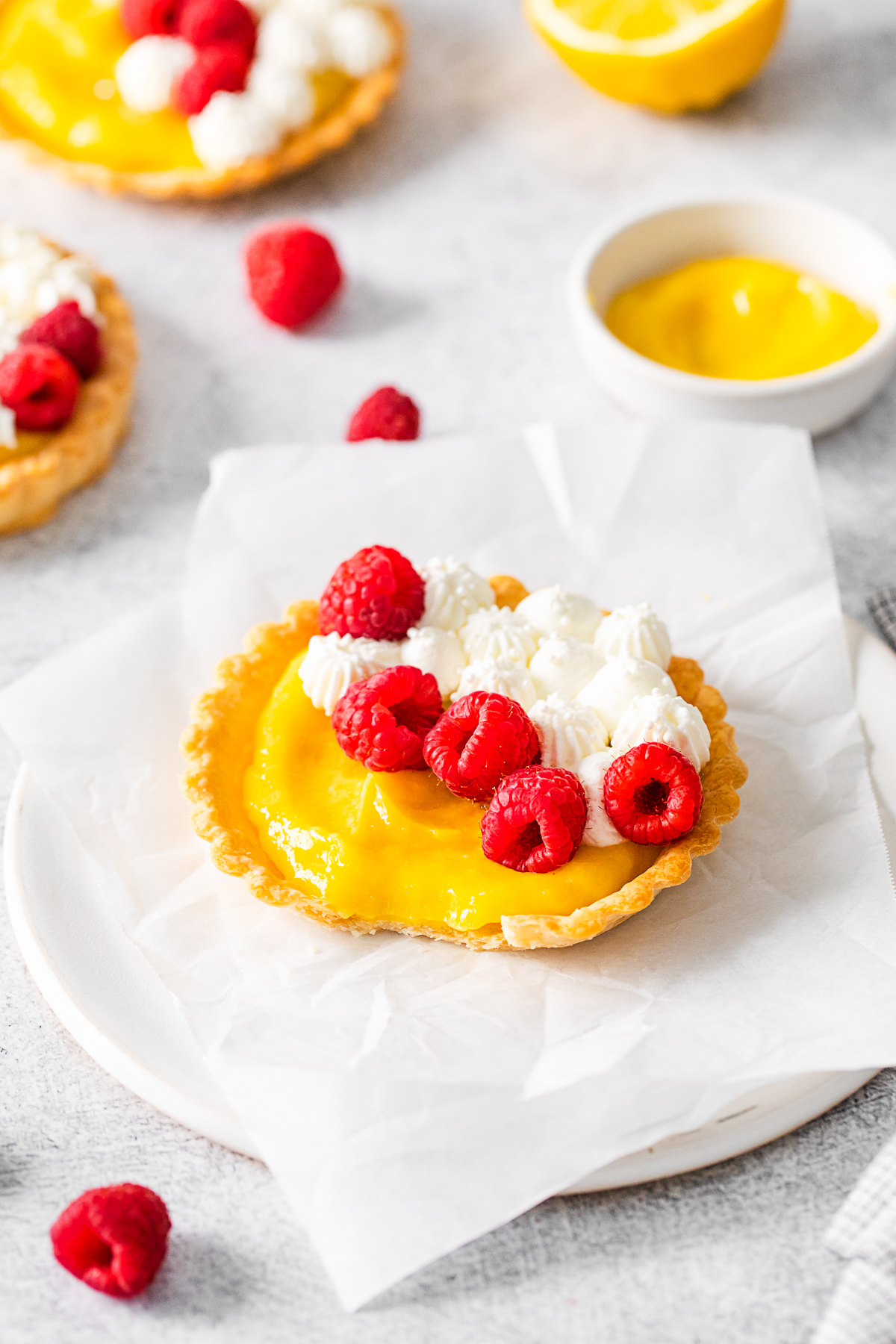 Lemon Curd Tarts topped with fresh berries.