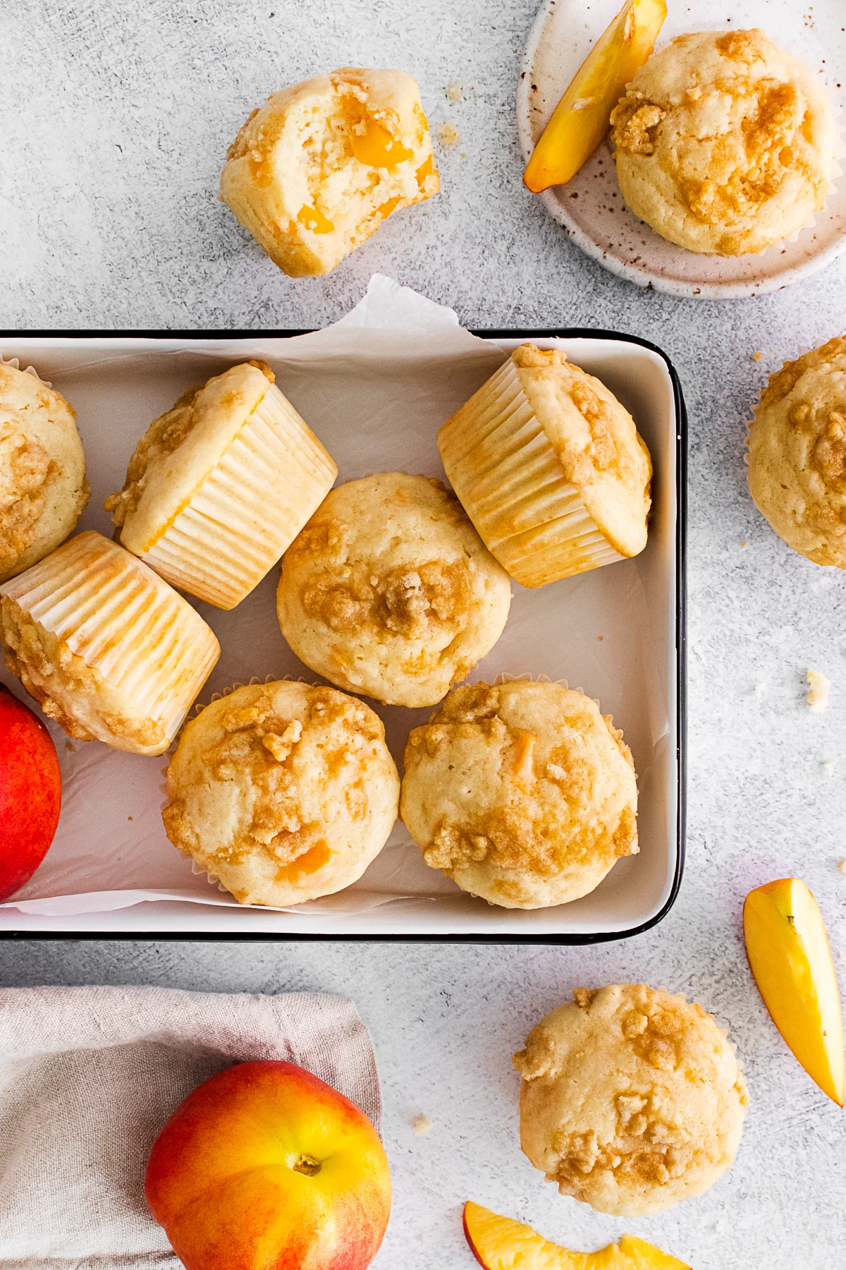 Peach Streusel Muffins in a decorative tin. 