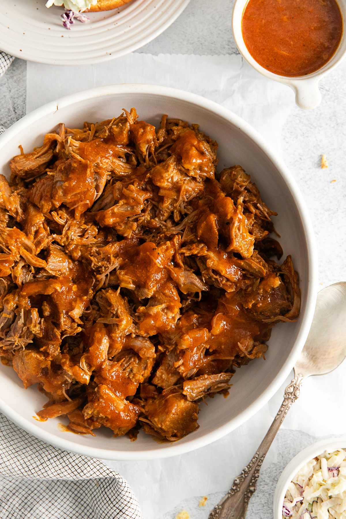 Slow Cooker BBQ Pulled Pork in a large white bowl. 