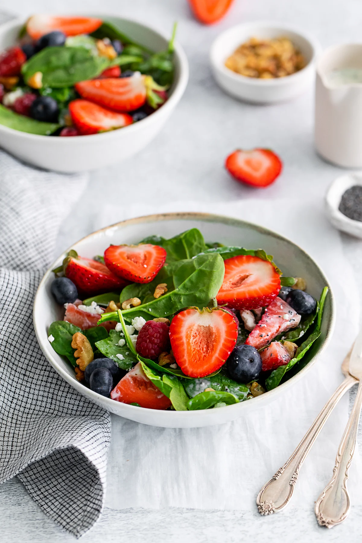 Spinach Berry Salad in a white bowl. 