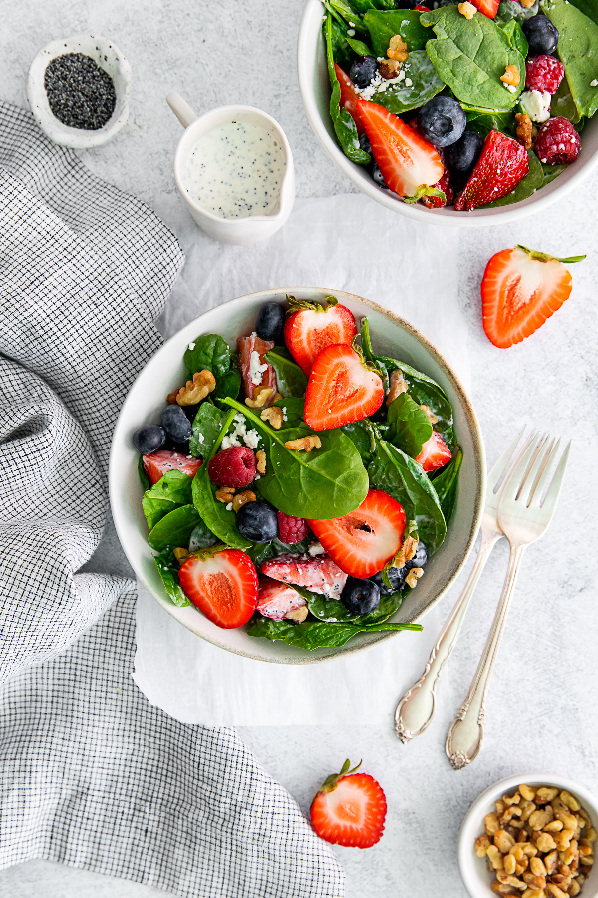 Spinach Berry Salad served with goat cheese and walnuts. 