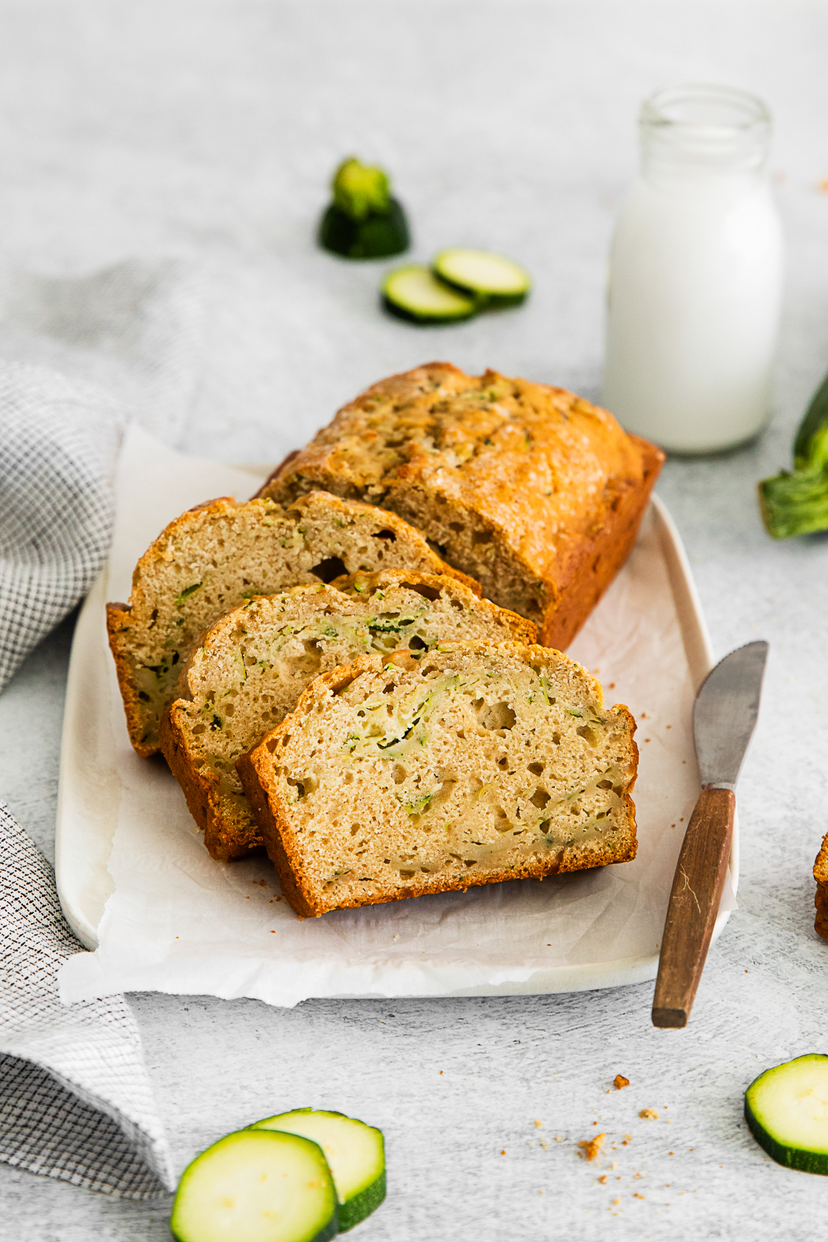 Zucchini Bread served with a knife for slicing. 