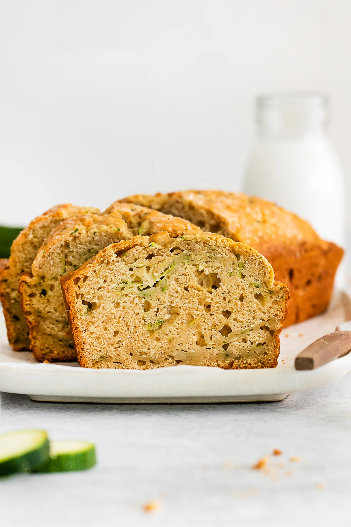 A slice of Zucchini Bread on a plate. 