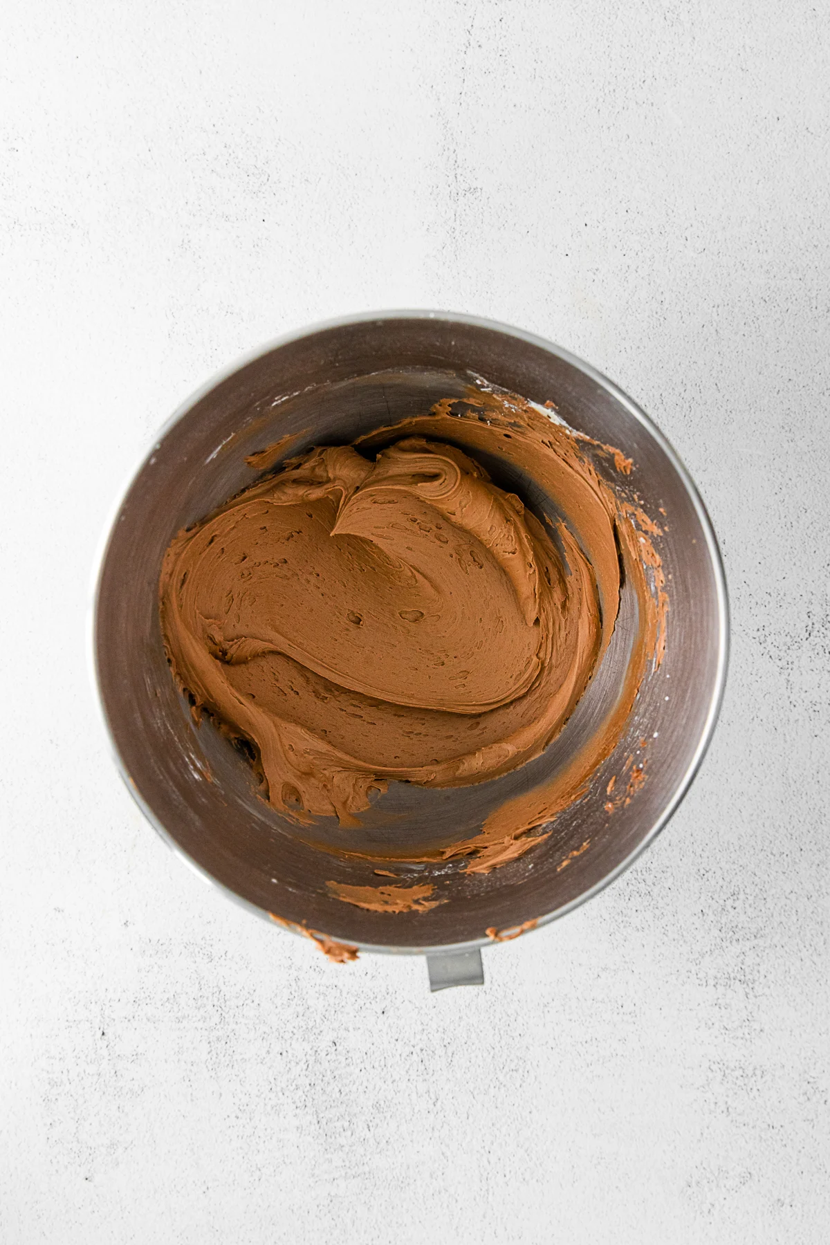 Chocolate frosting in a bowl. 