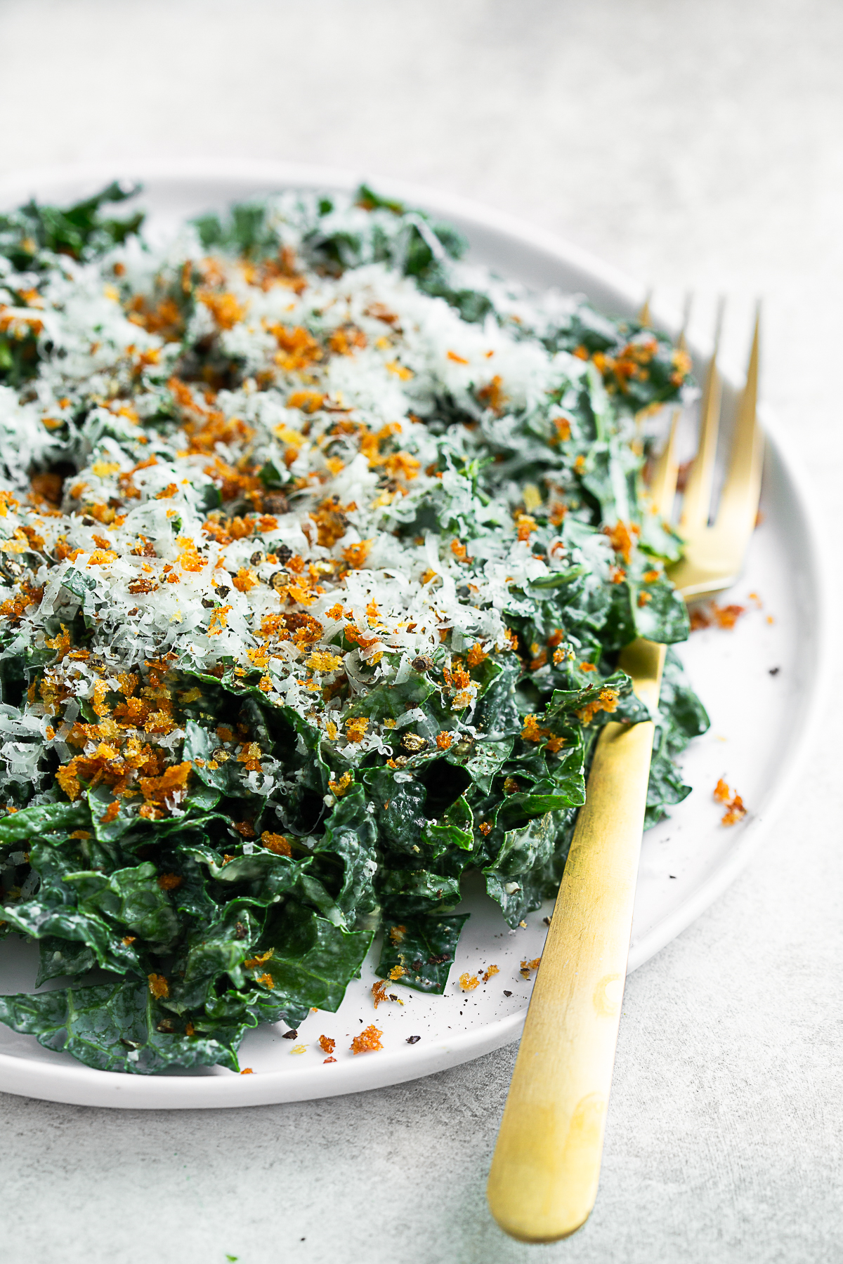 Chopped Kale Caesar Salad topped with toasted panko breadcrumbs. 