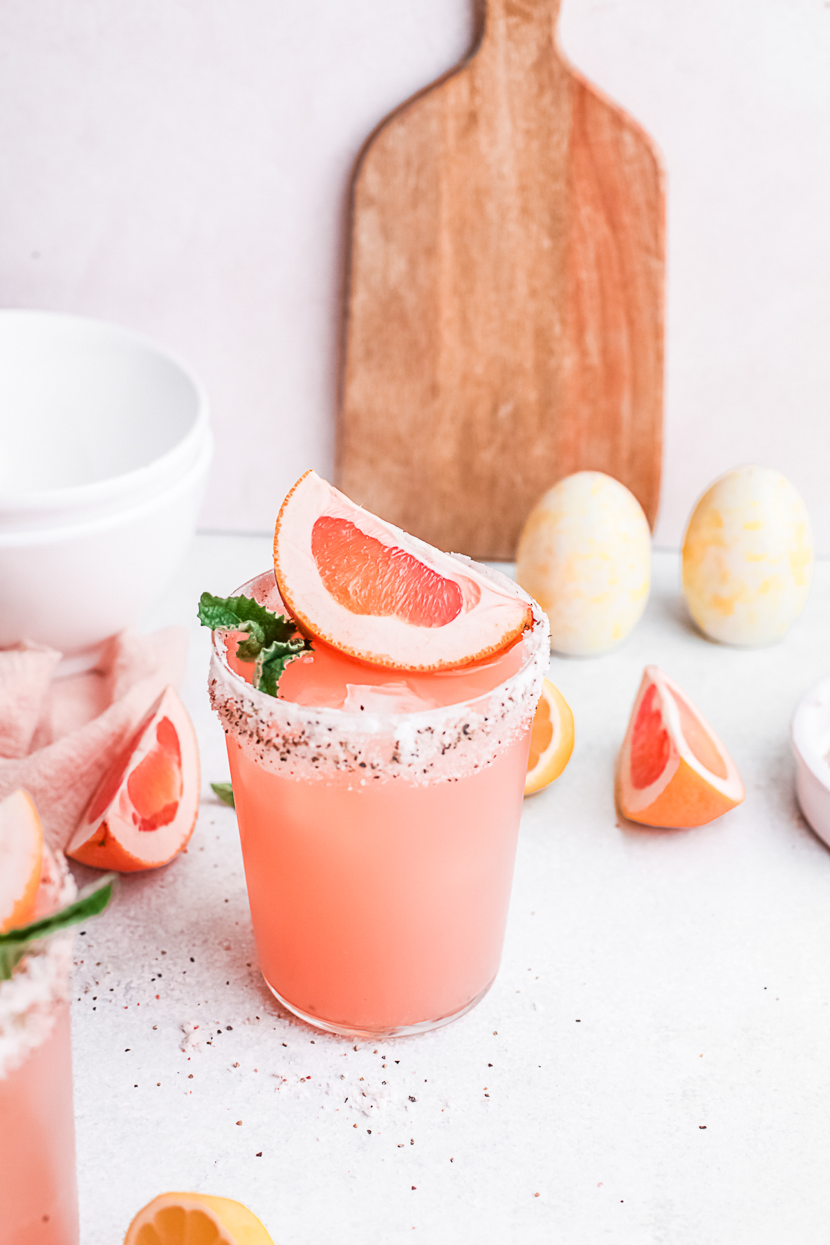 Grapefruit Paloma topped with a fresh grapefruit wedge. 