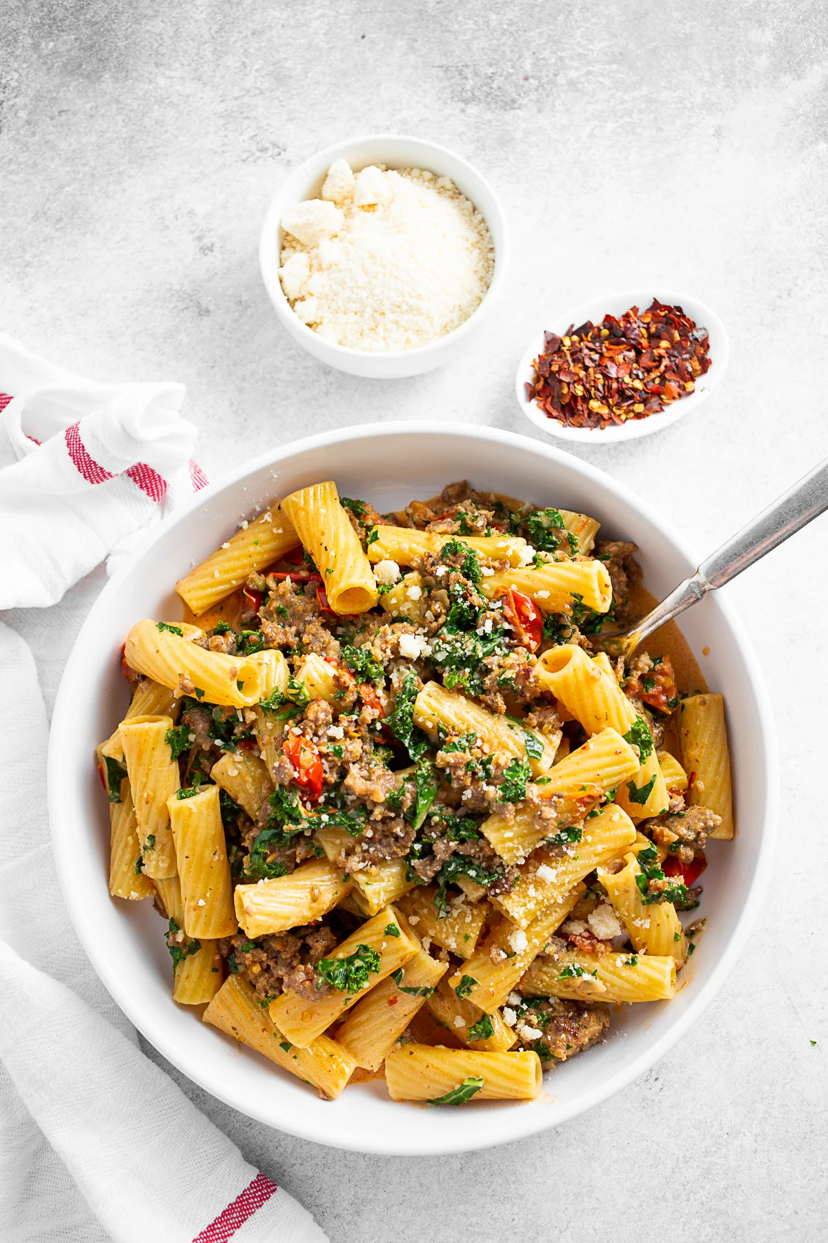 Italian Sausage Kale Pasta served with Parmesan cheese. 