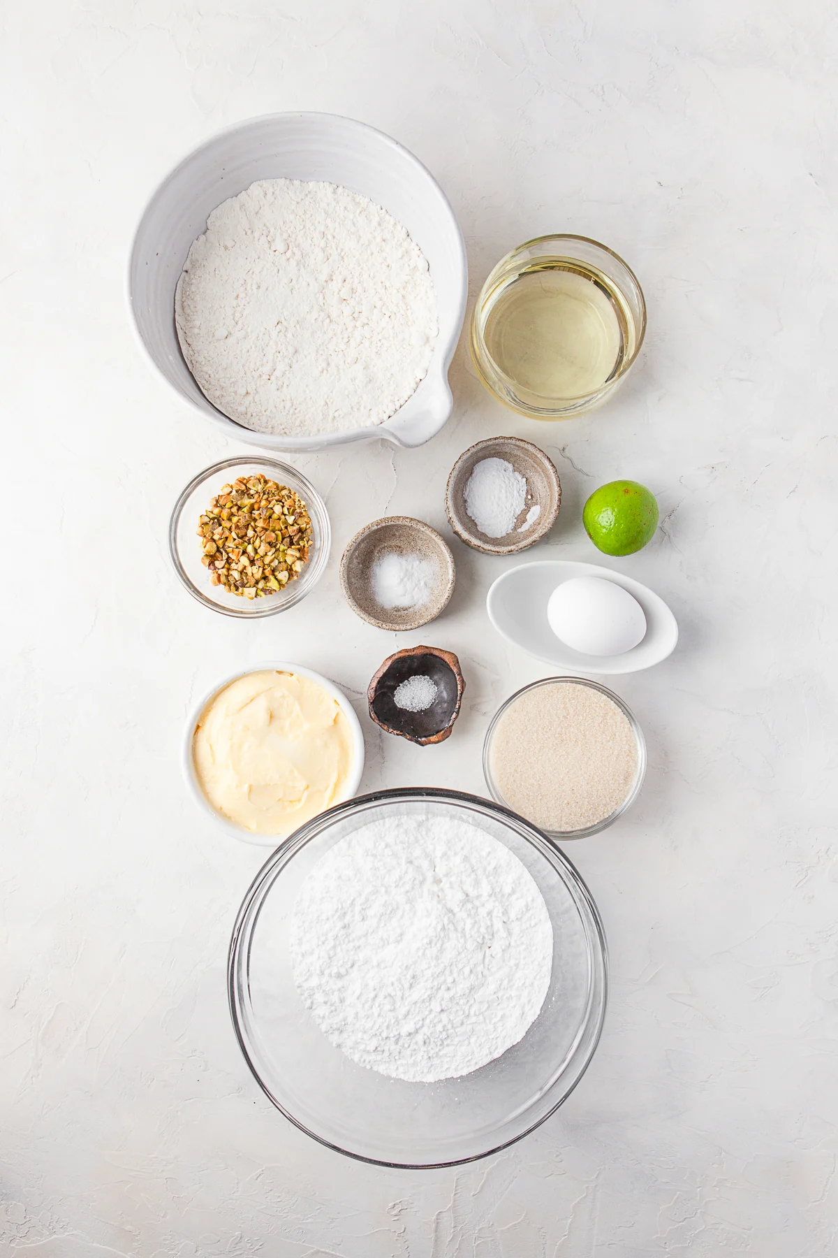 Ingredients to make Lime Glazed Sugar Cookies on a table. 