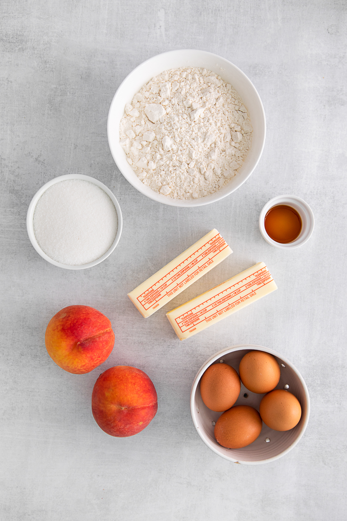 Ingredients to make pound cake on a table. 