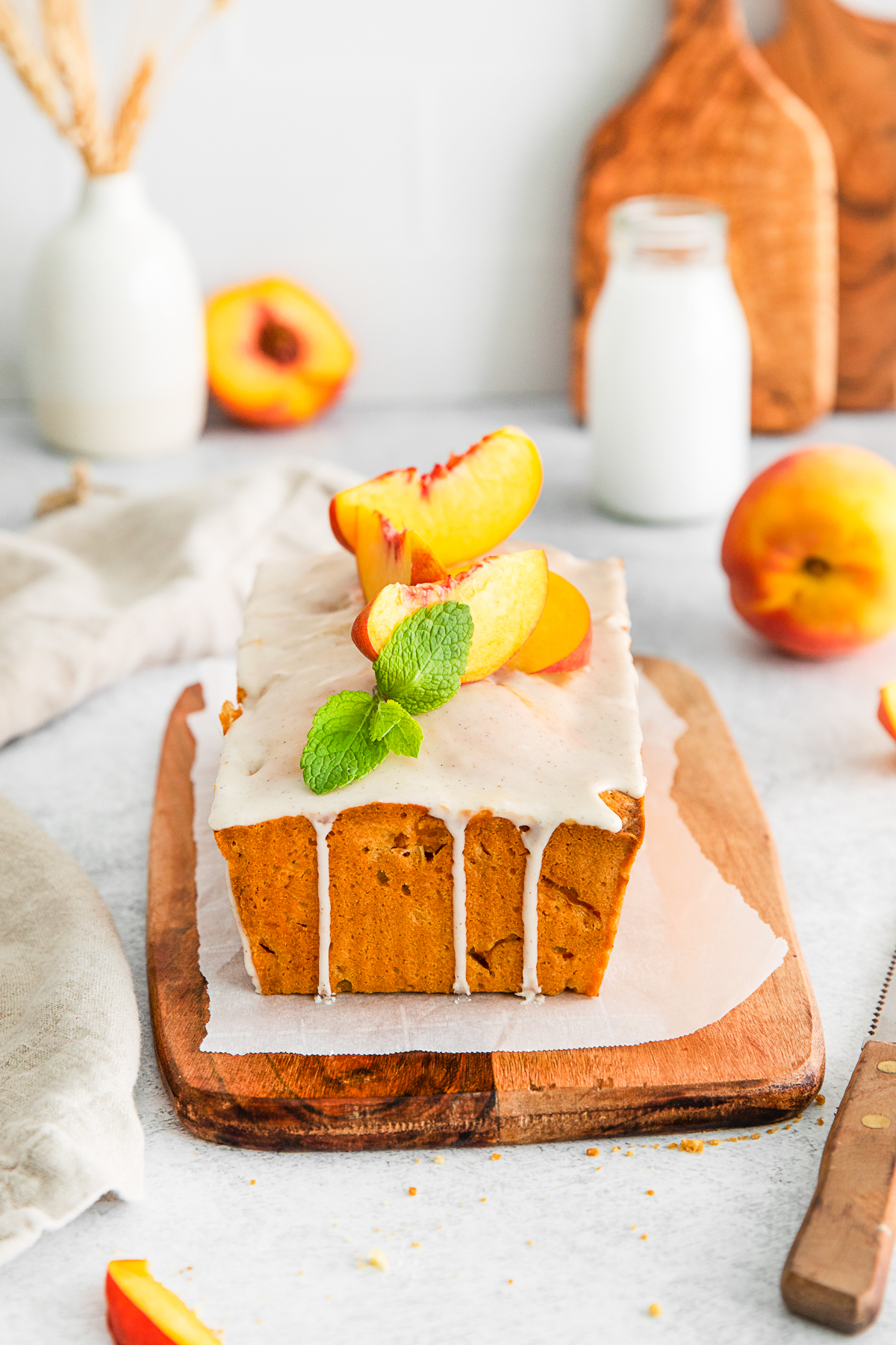Peach Pound Cake topped with fresh sliced peaches. 