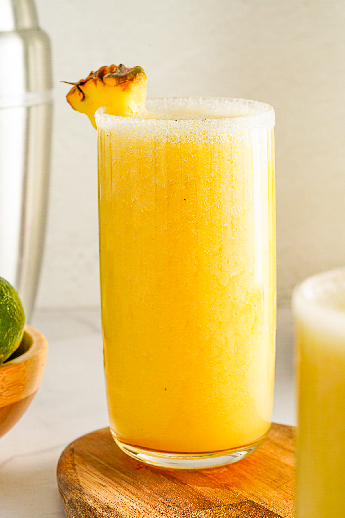 Mango Pineapple Smoothie in a tall breakfast glass. 