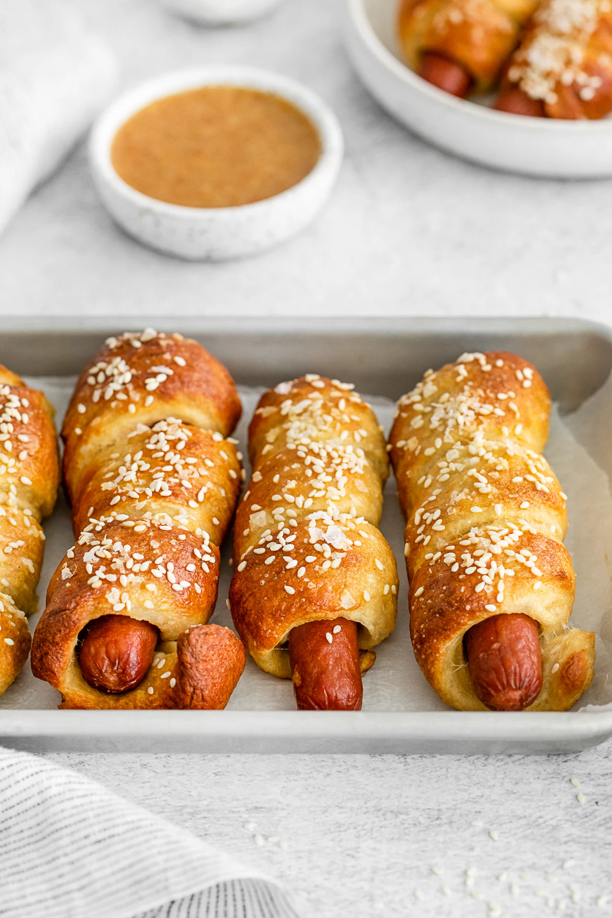 Soft Pretzel Dogs topped with sesame seeds and salt. 