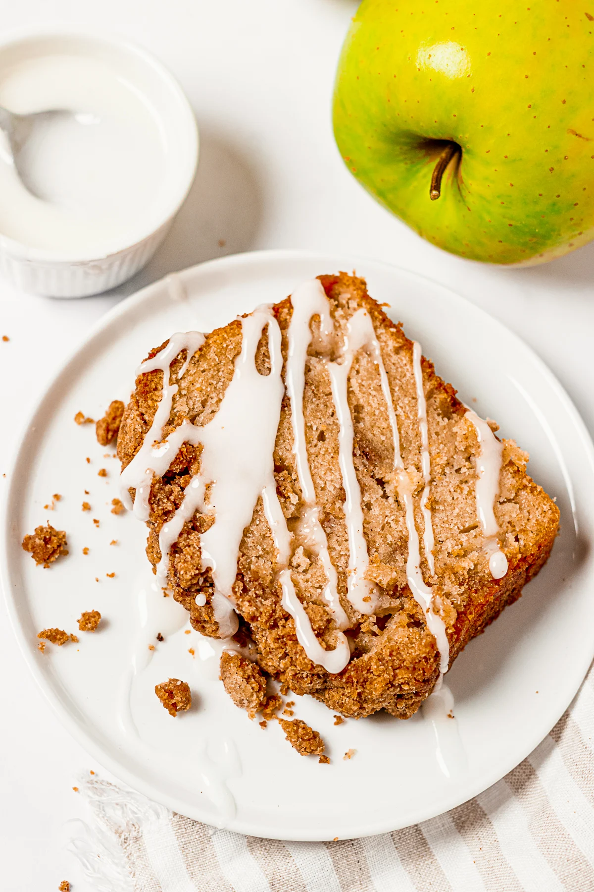 Apple Streusel Bread topped with glaze. 