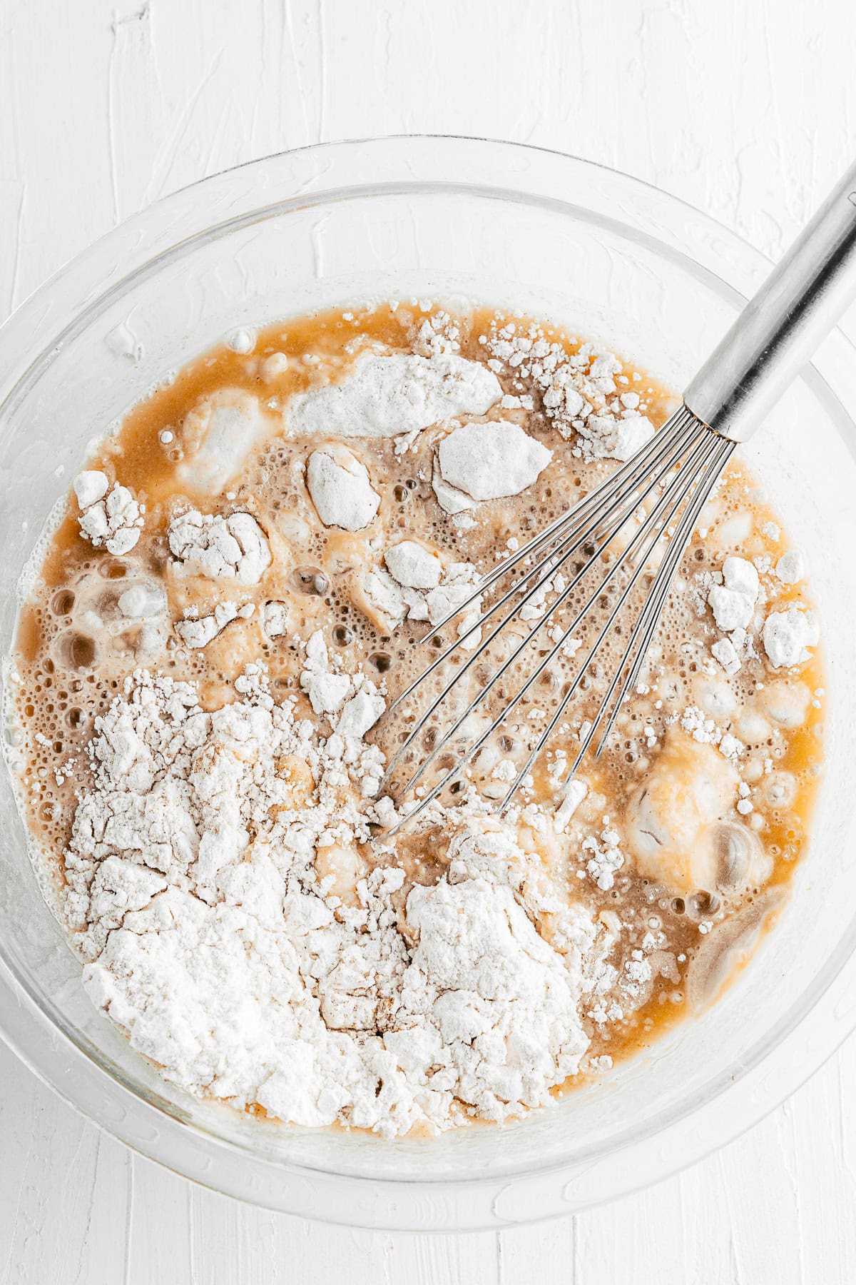 Flour getting mixed into muffin batter. 