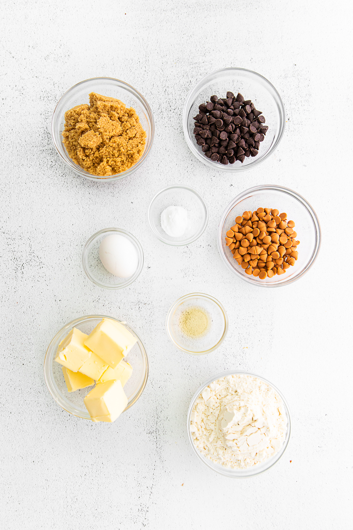 Ingredients to make Butterscotch Chocolate Chip Cookies on a table. 