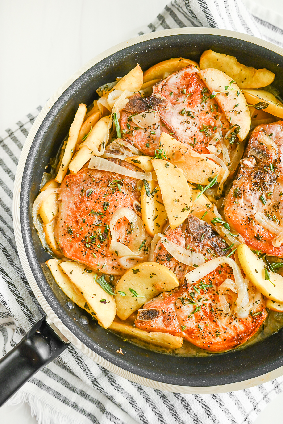 Pork Chops with Apples in a skillet. 