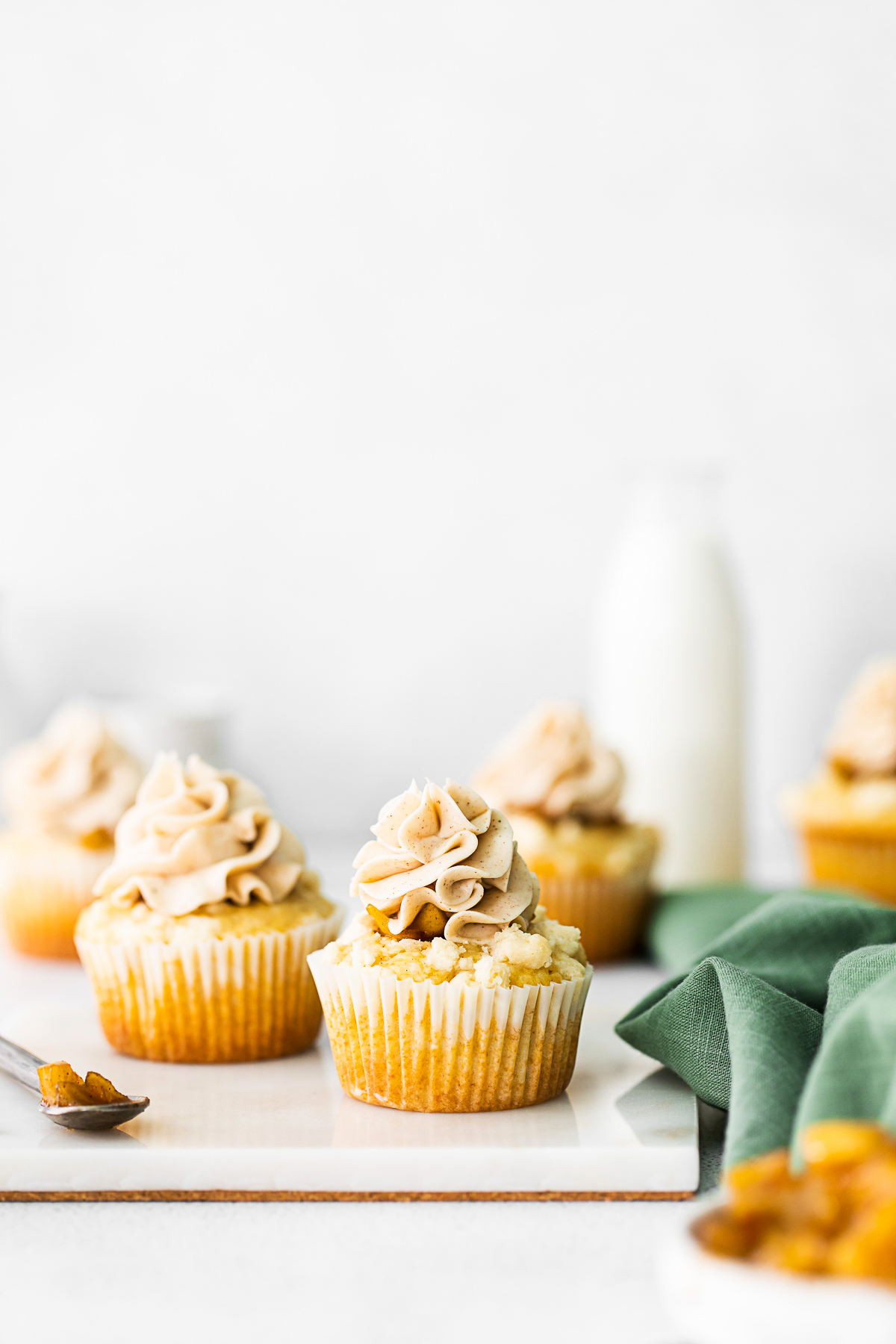 Apple Pie Cupcakes topped with frosting. 