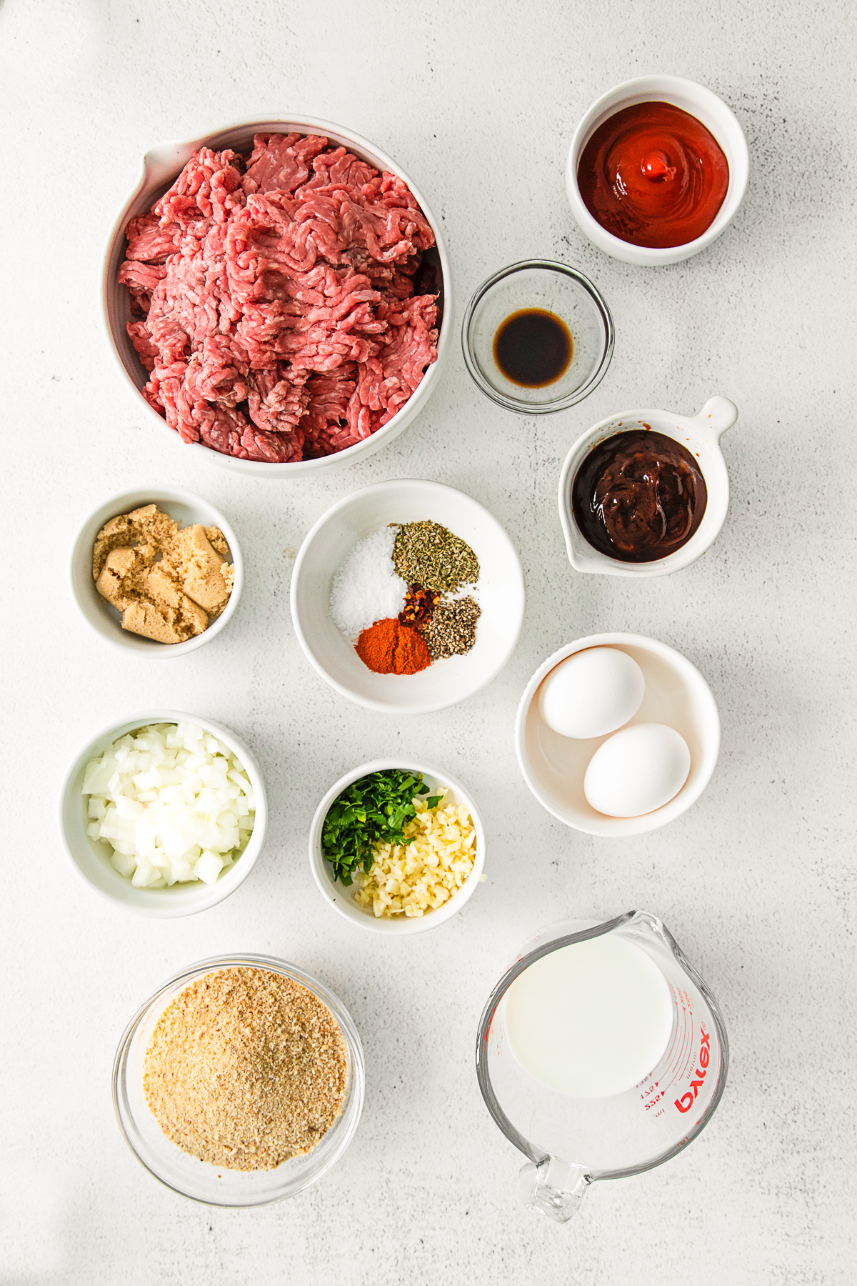 Ingredients to make BBQ Glazed Meatloaf on a table. 