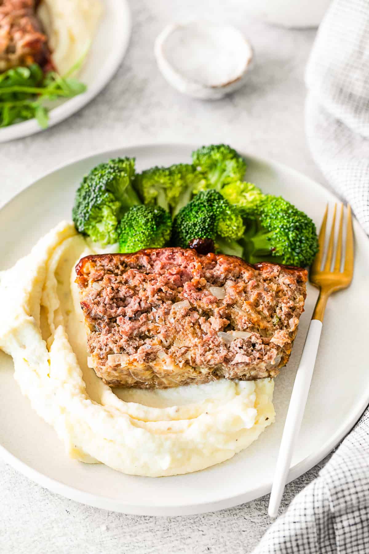 BBQ Glazed Meatloaf served with potatoes and broccoli.