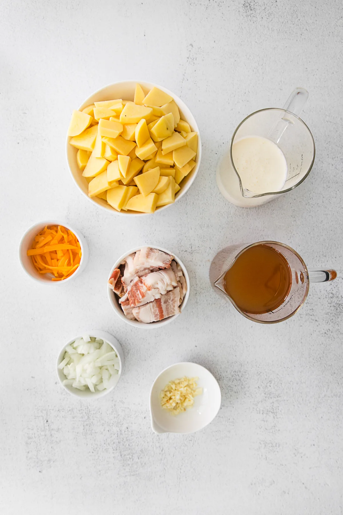 Instant Pot Loaded Potato Soup ingredients on a table. 