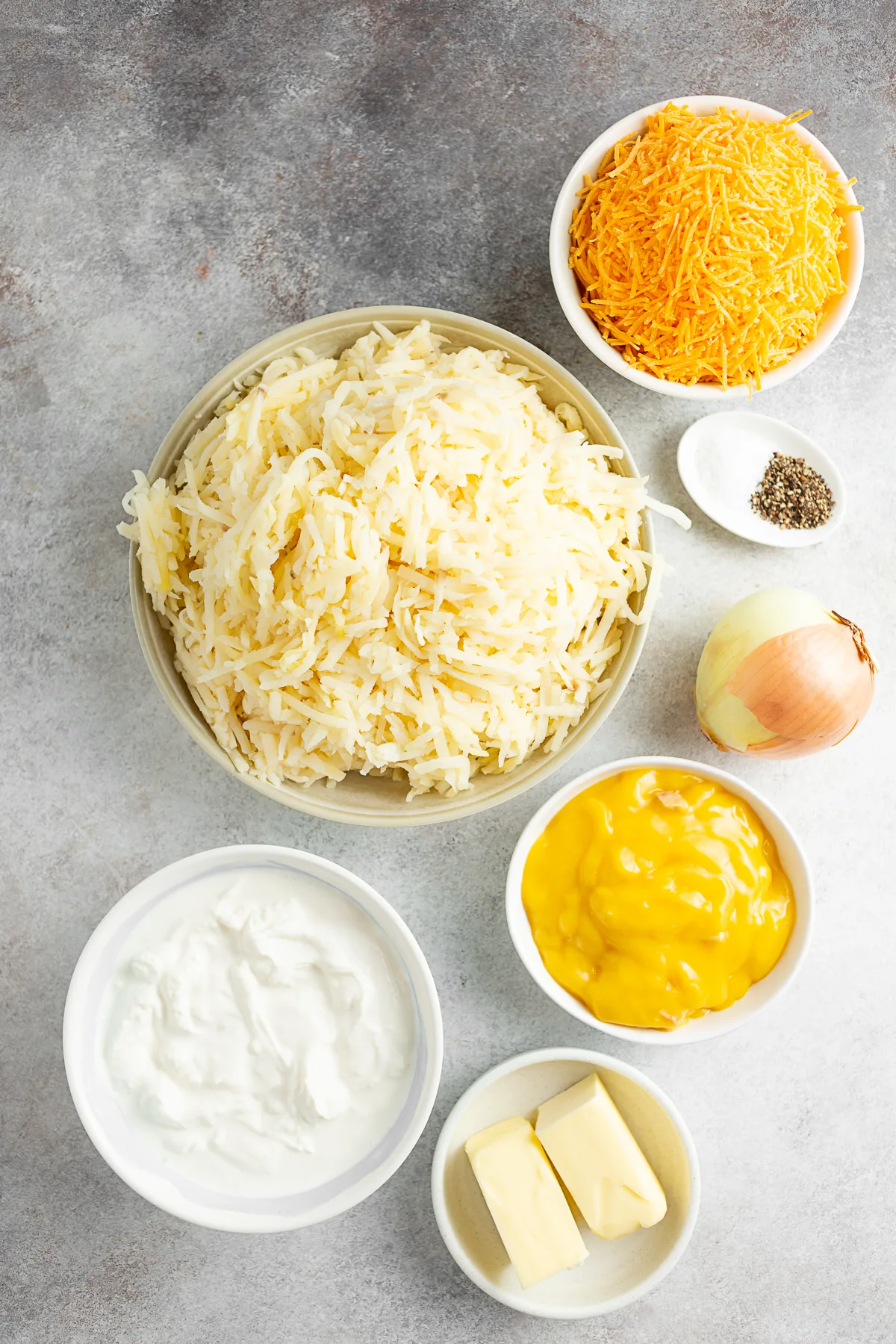 Cheesy Potatoes (Funeral Potatoes) ingredients on a table. 