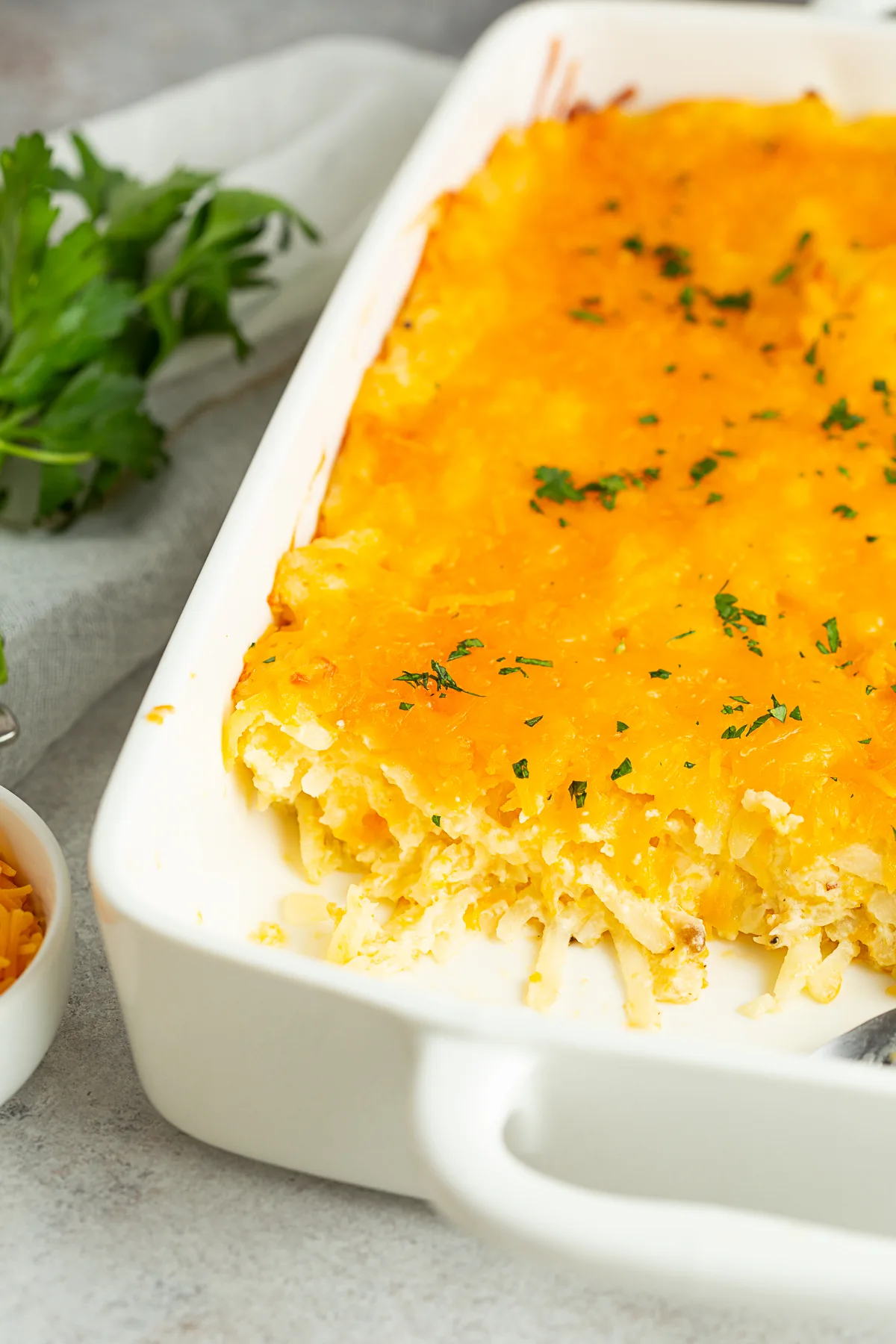 Cheesy Potatoes (Funeral Potatoes) in a casserole dish. 