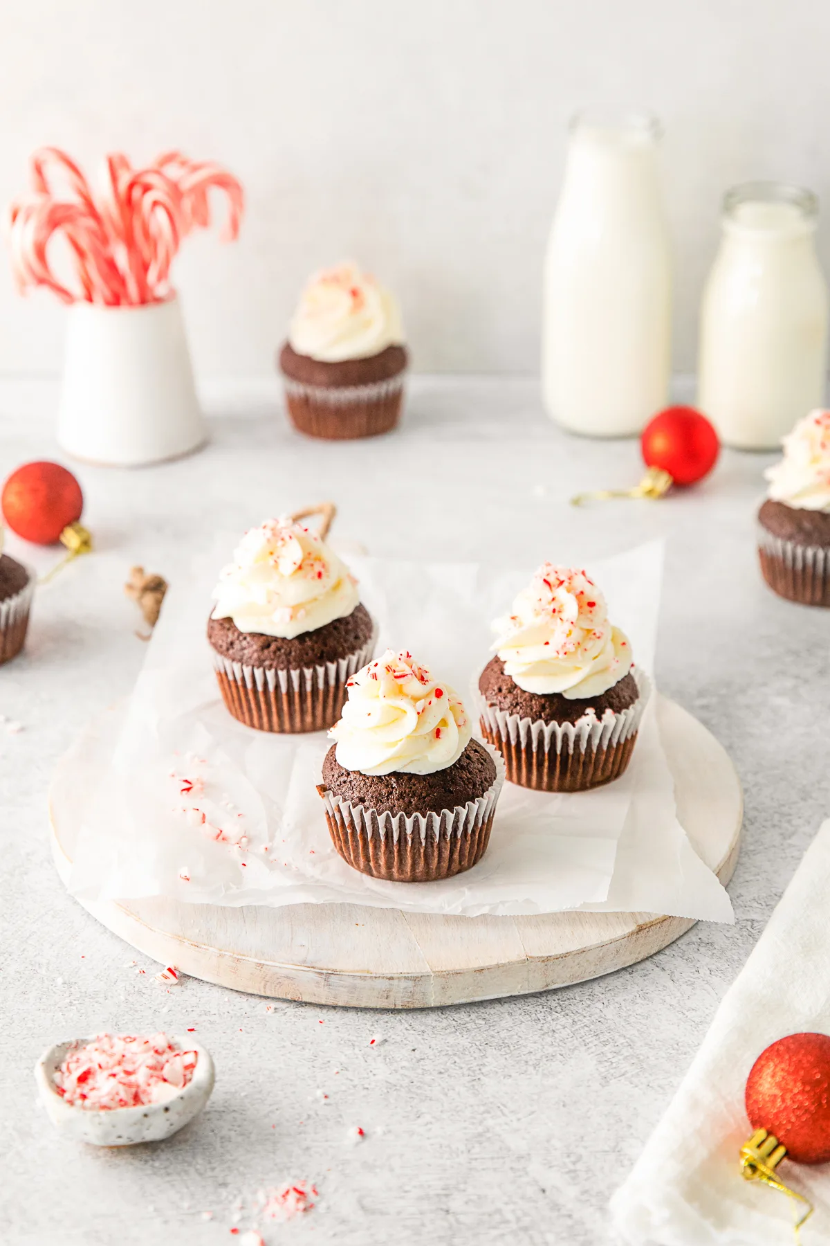 Peppermint Bark Cupcakes sprinkled with crushed candy canes. 