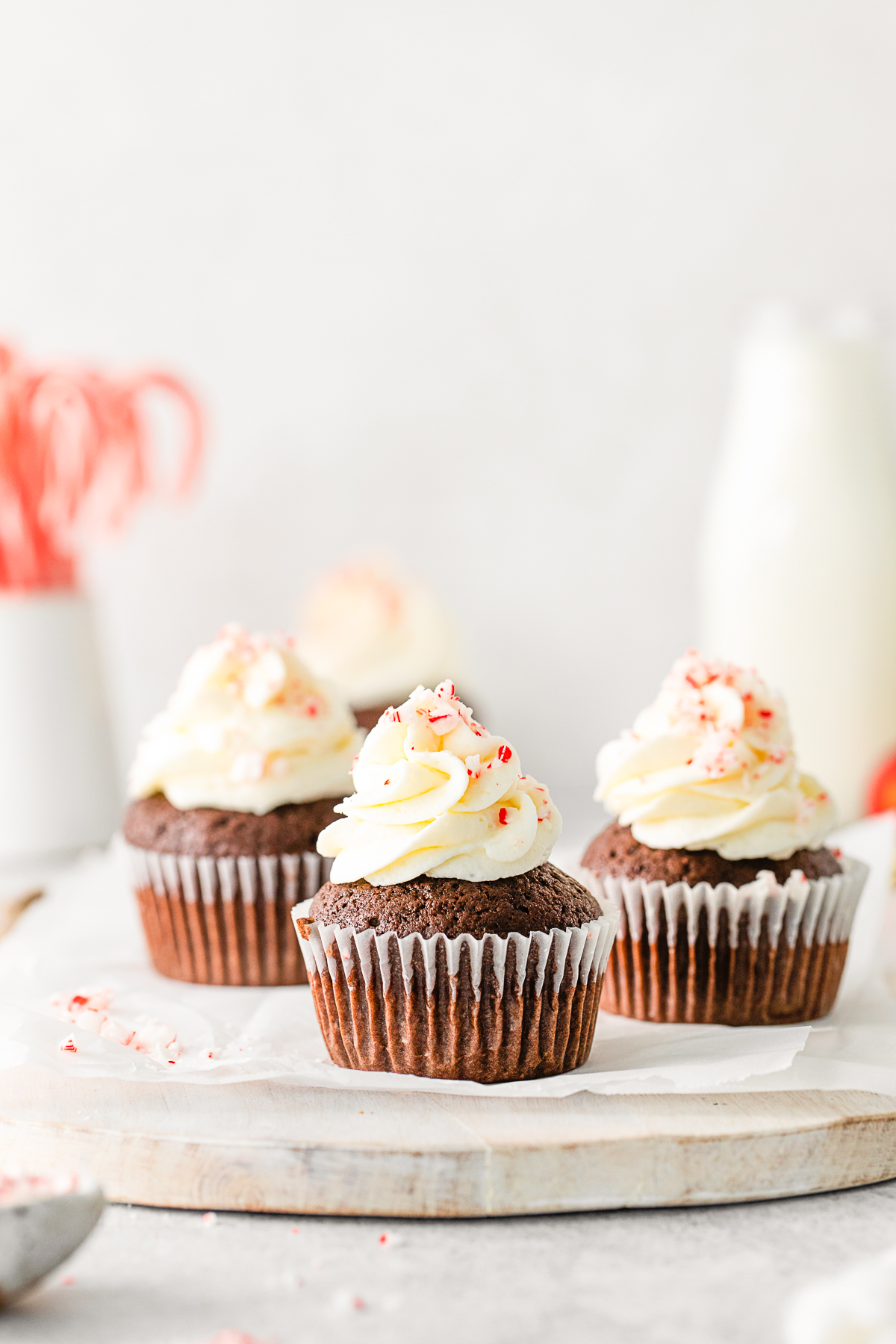 Peppermint Bark Cupcakes sitting on a serving tray. 
