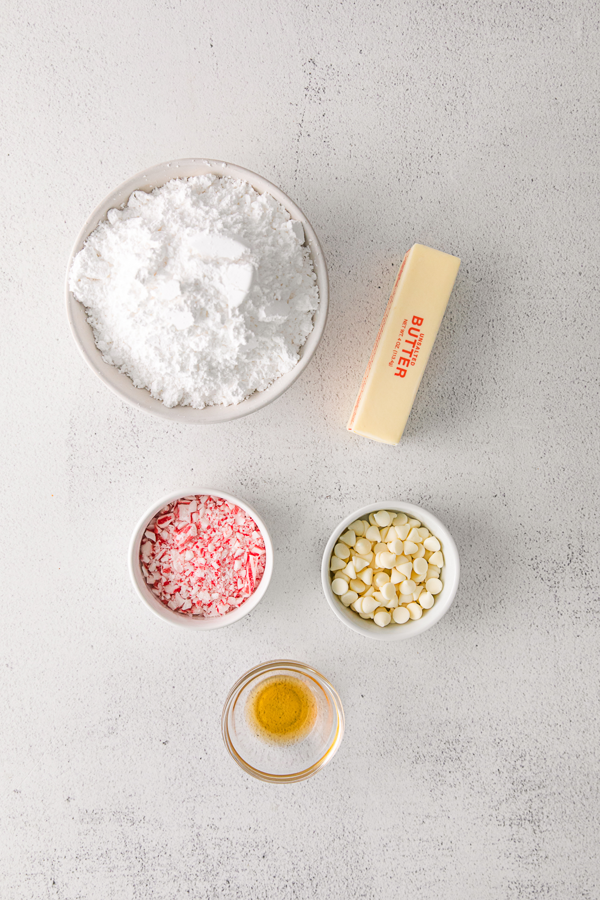 Ingredients to make white chocolate buttercream on a table. 
