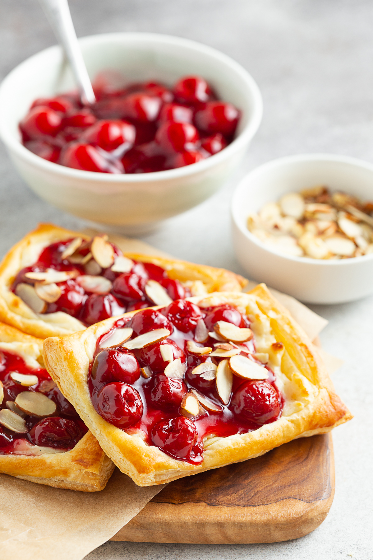 Easy Cherry Danish served on a wooden serving board. 
