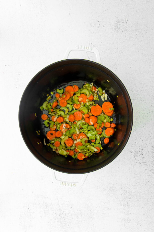 Vegetables sautéed in a soup pot. 