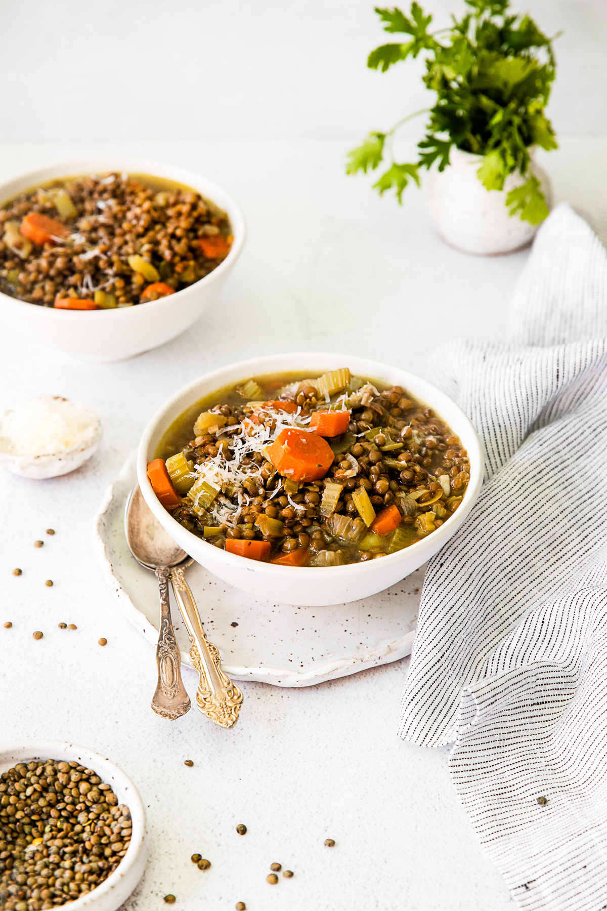 Healthy French Lentil Soup in a bowl with a spoon on the side. 