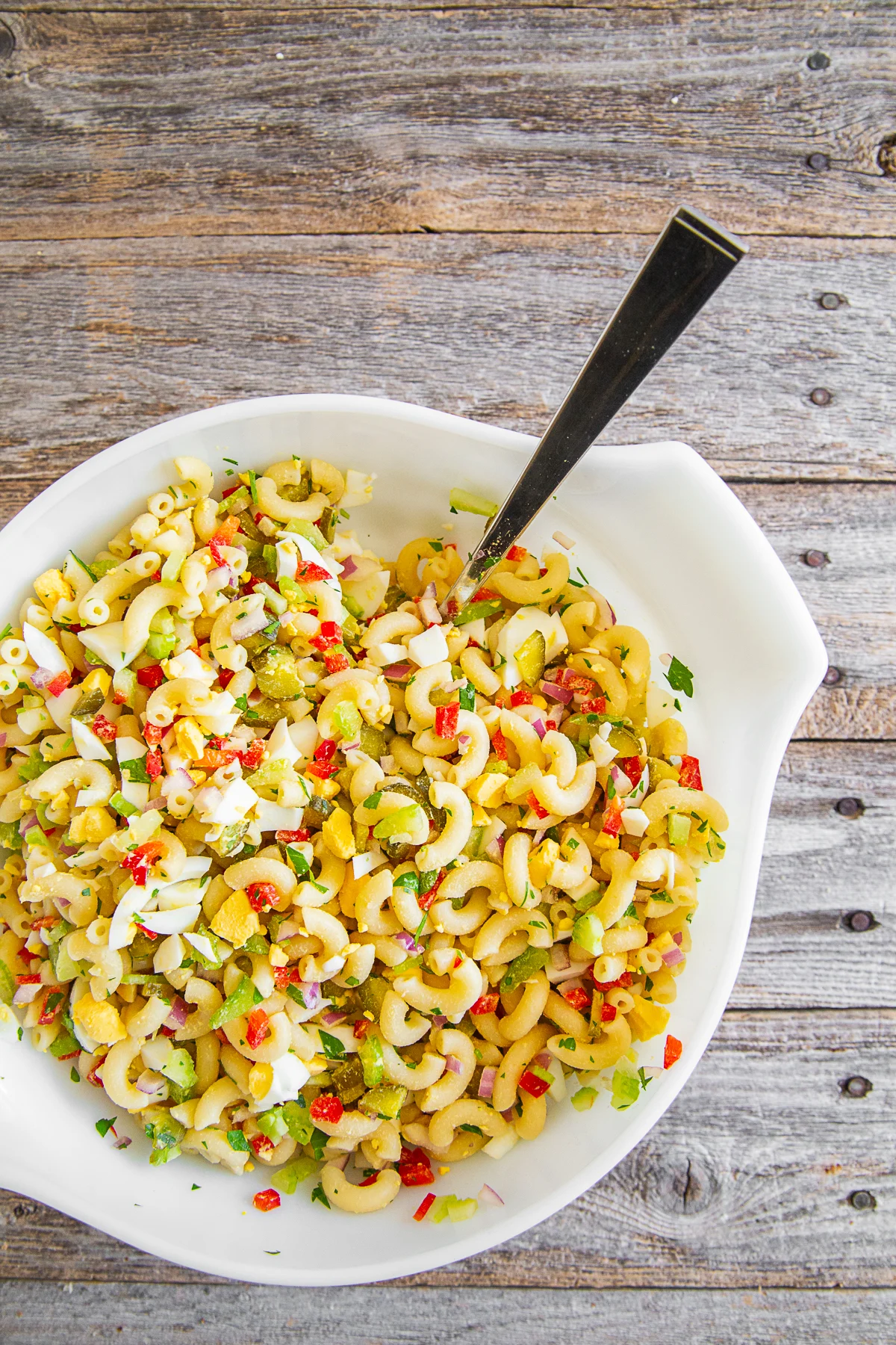 Classic Macaroni Salad in a bowl without dressing. 