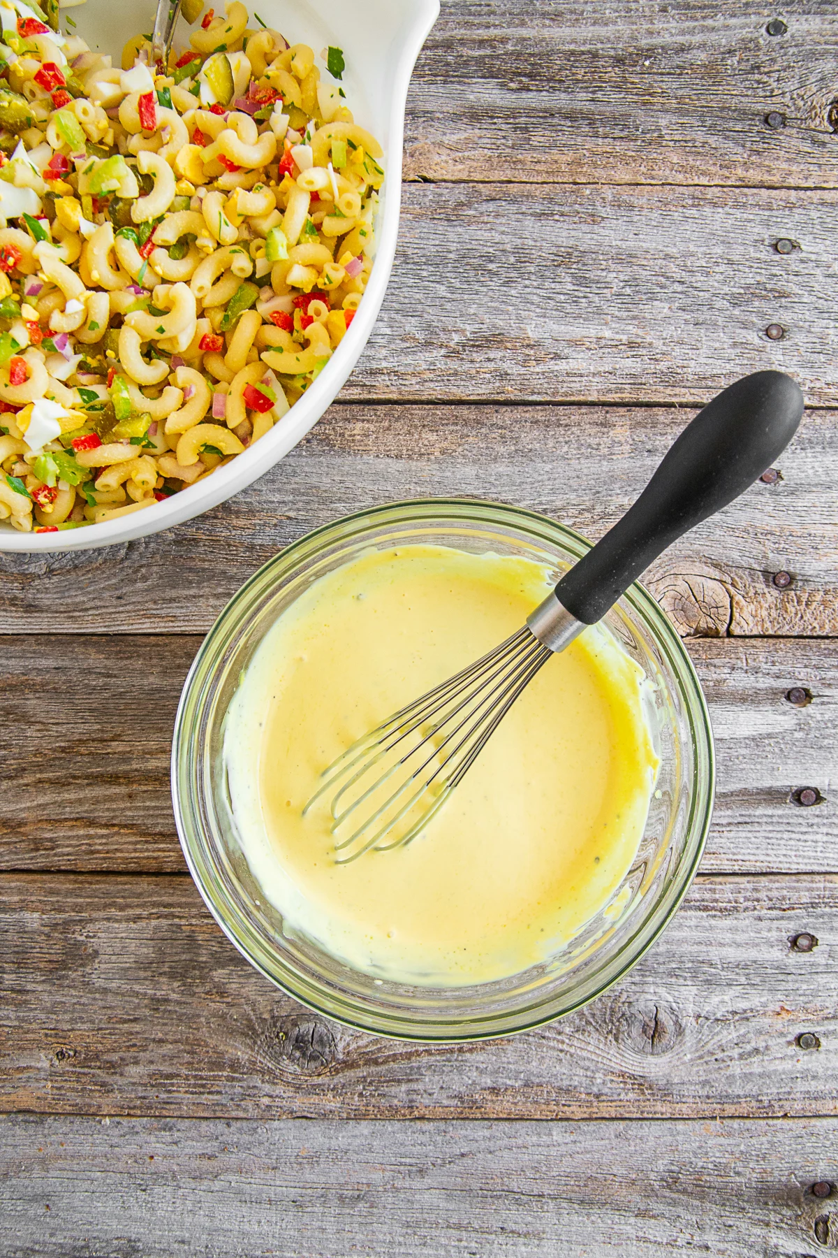 A bowl of dressing for macaroni salad. 