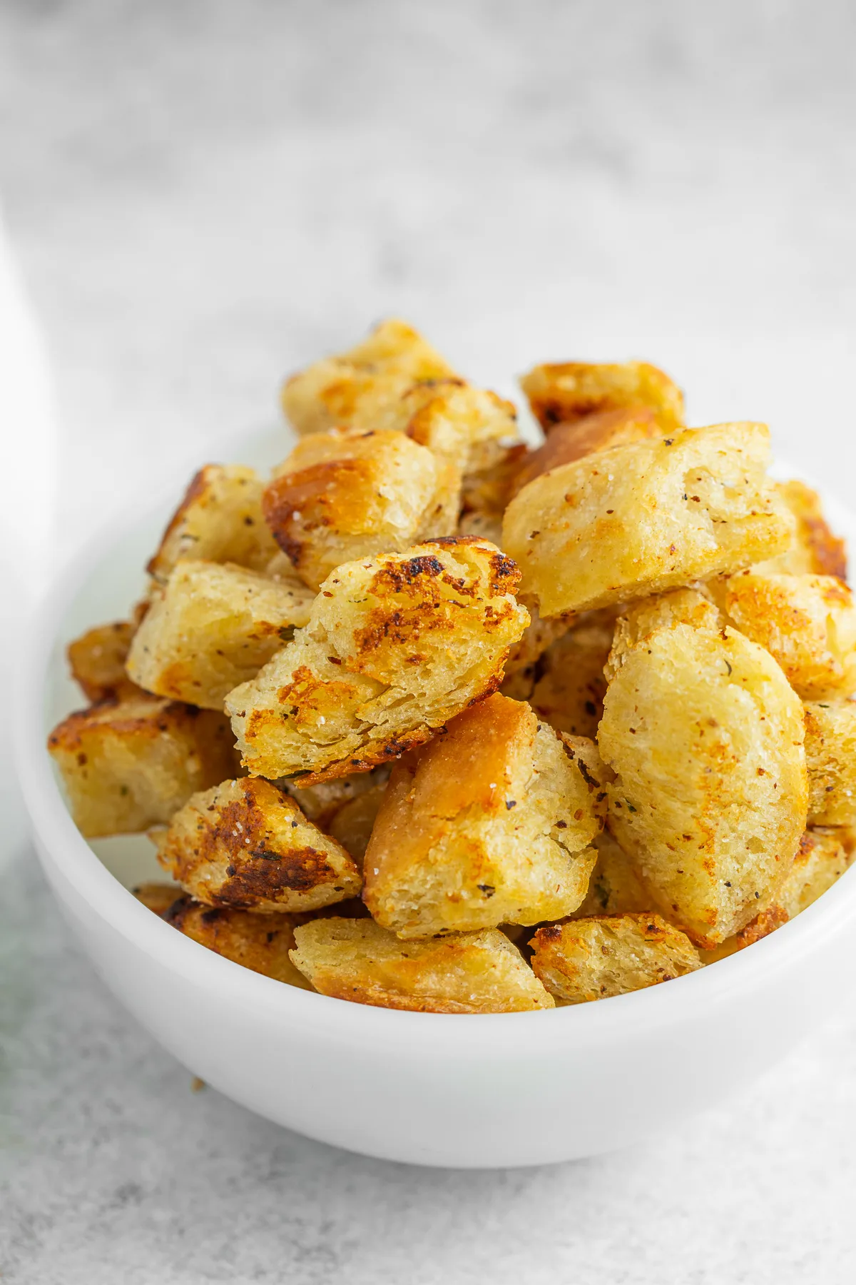 Homemade Croutons with Garlic Butter in a small white bowl. 