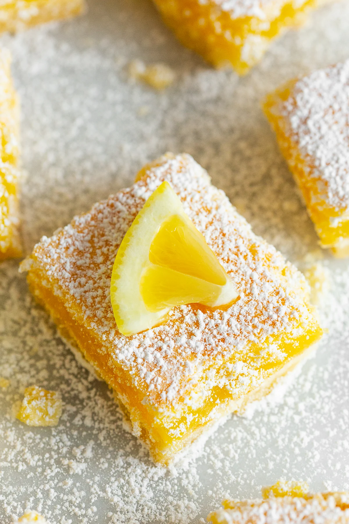 Homemade Lemon Bars with fresh lemon on top. 