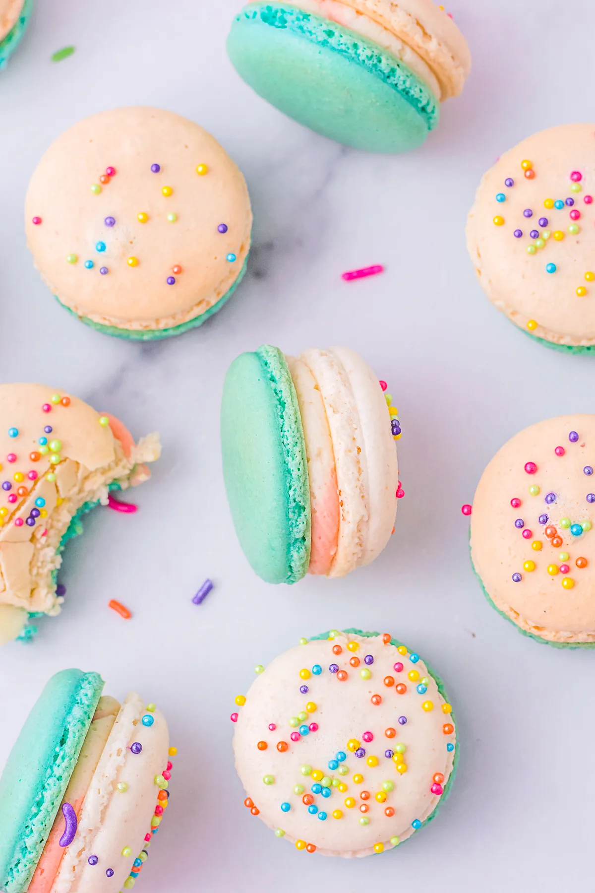 birthday cake macarons on a marble tray