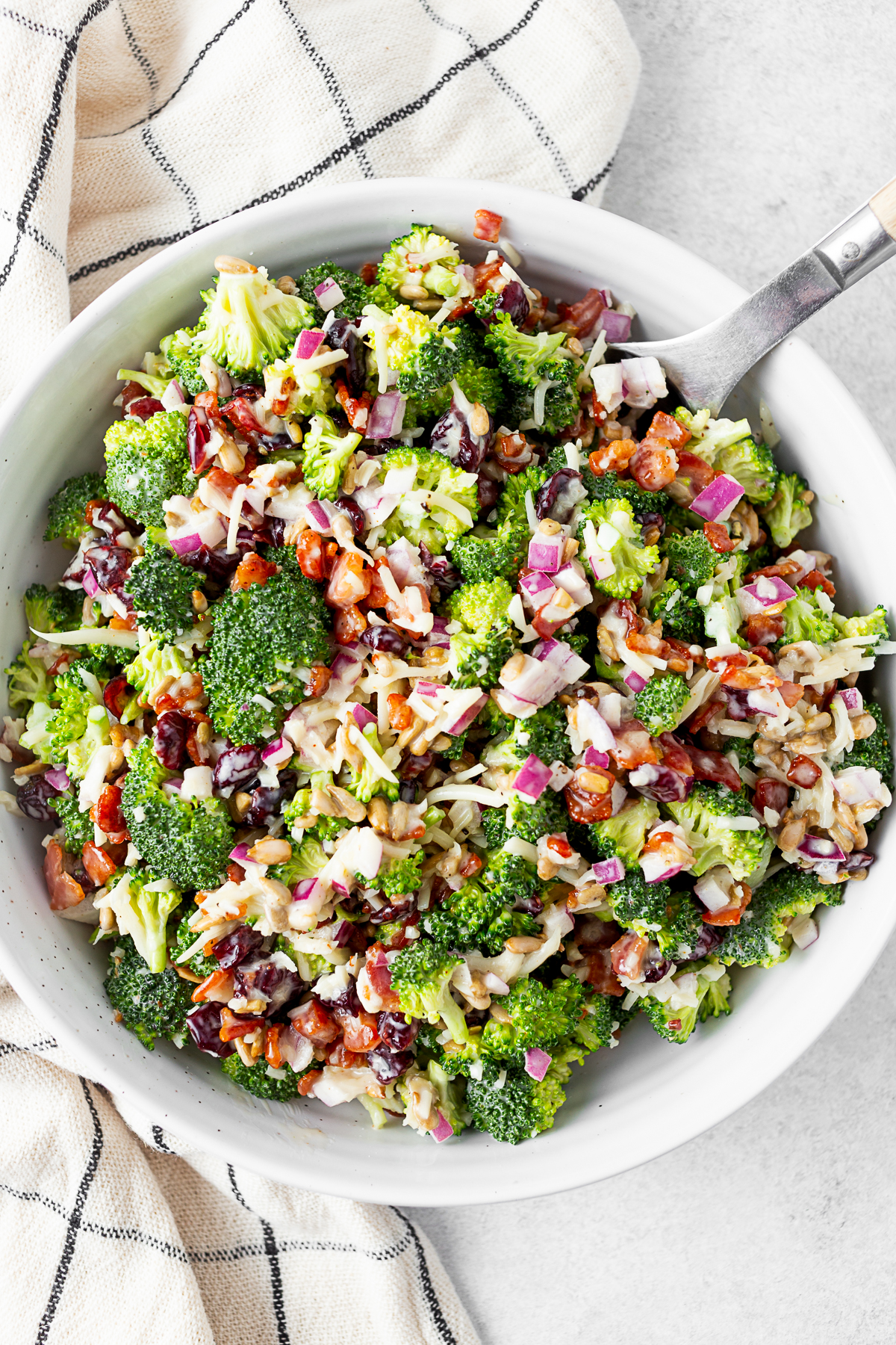 The Best Broccoli Salad in a bowl with a napkin. 
